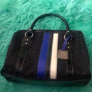 A shoulder bag and it is blue white and black